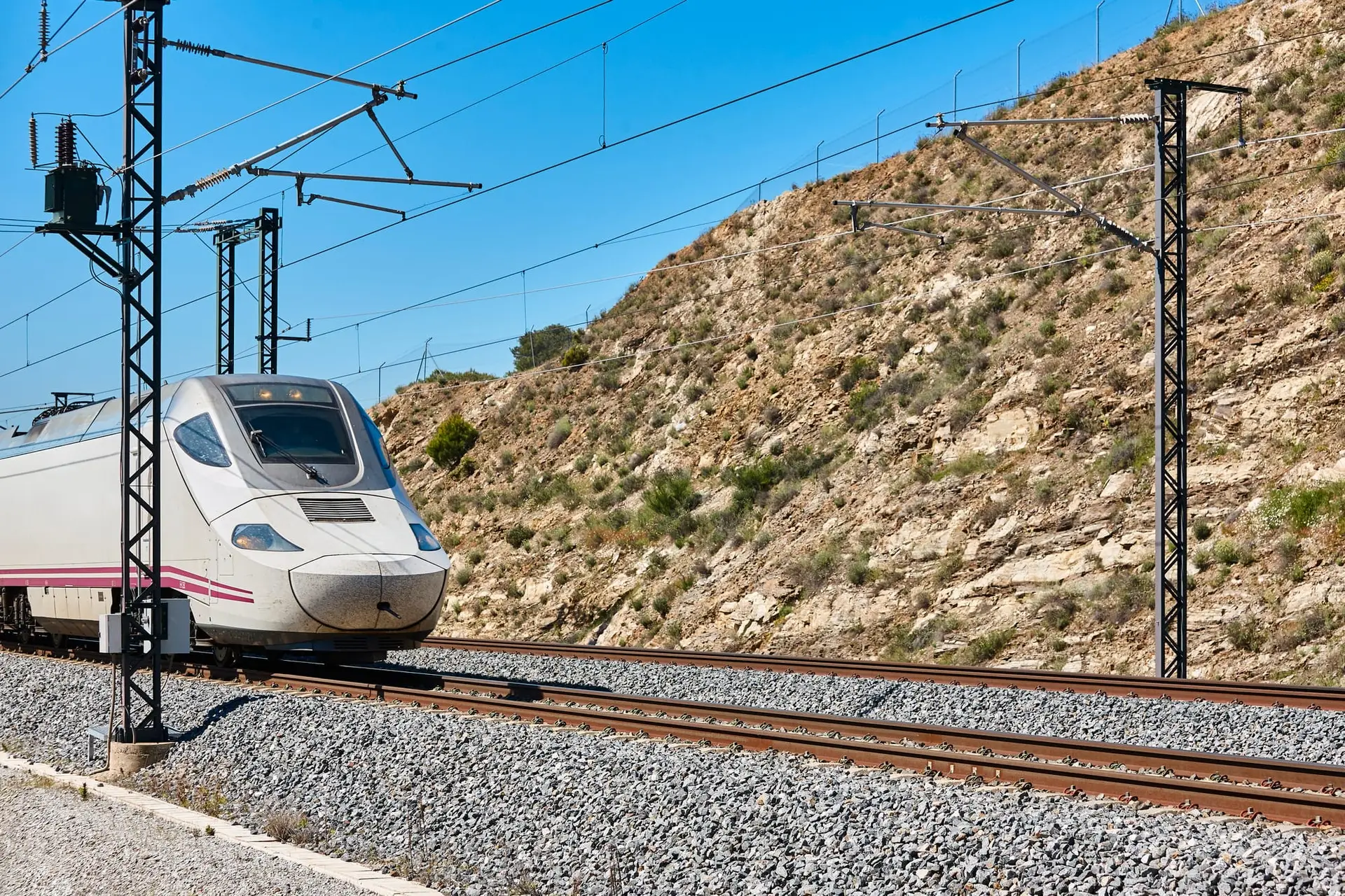 A modern high-speed AVE train in Spain, showcasing advanced railway and renewable energy transport technologyâhelping expats and travelers move efficiently.
